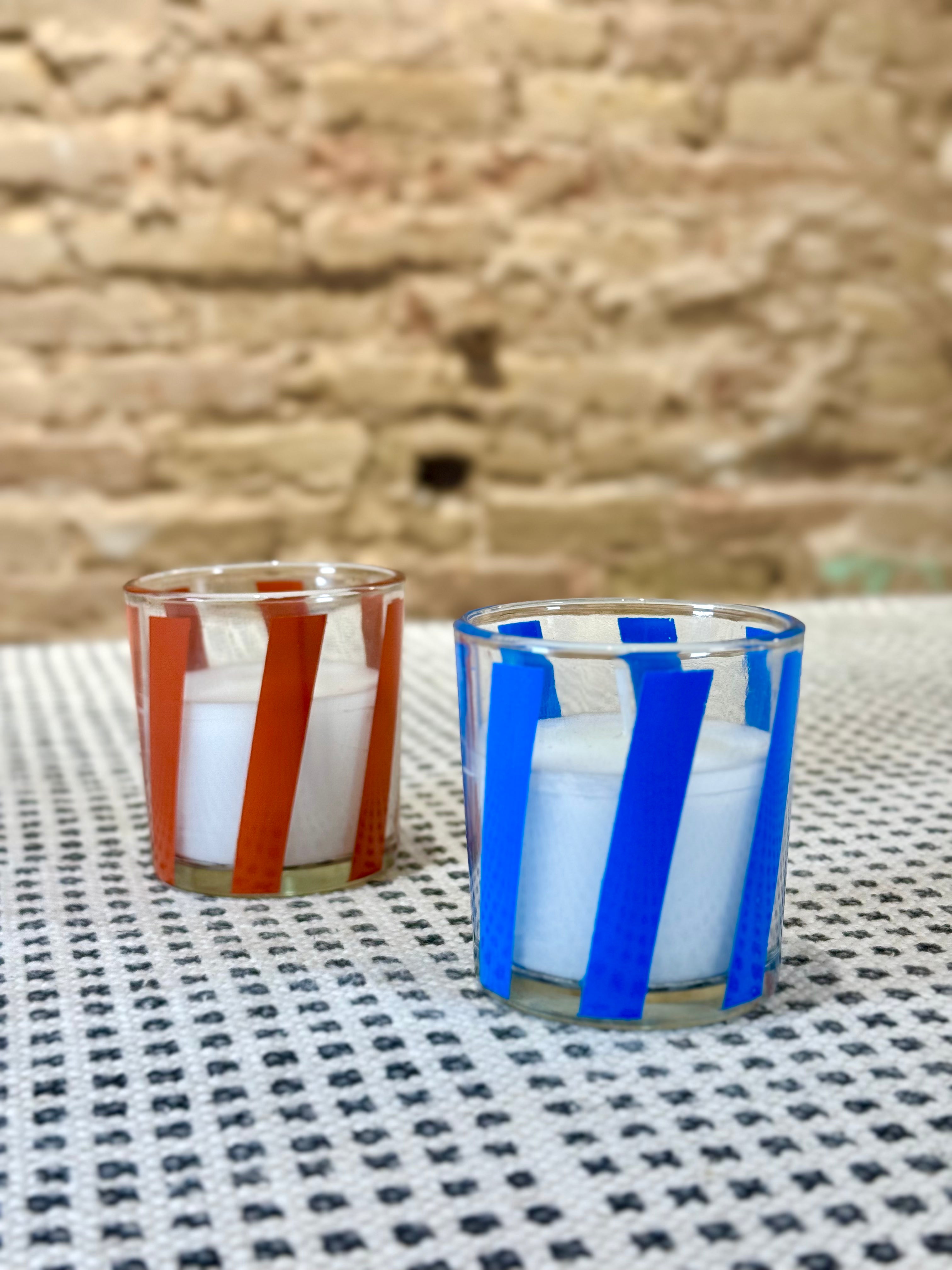 Velas en recipiente de vidrio