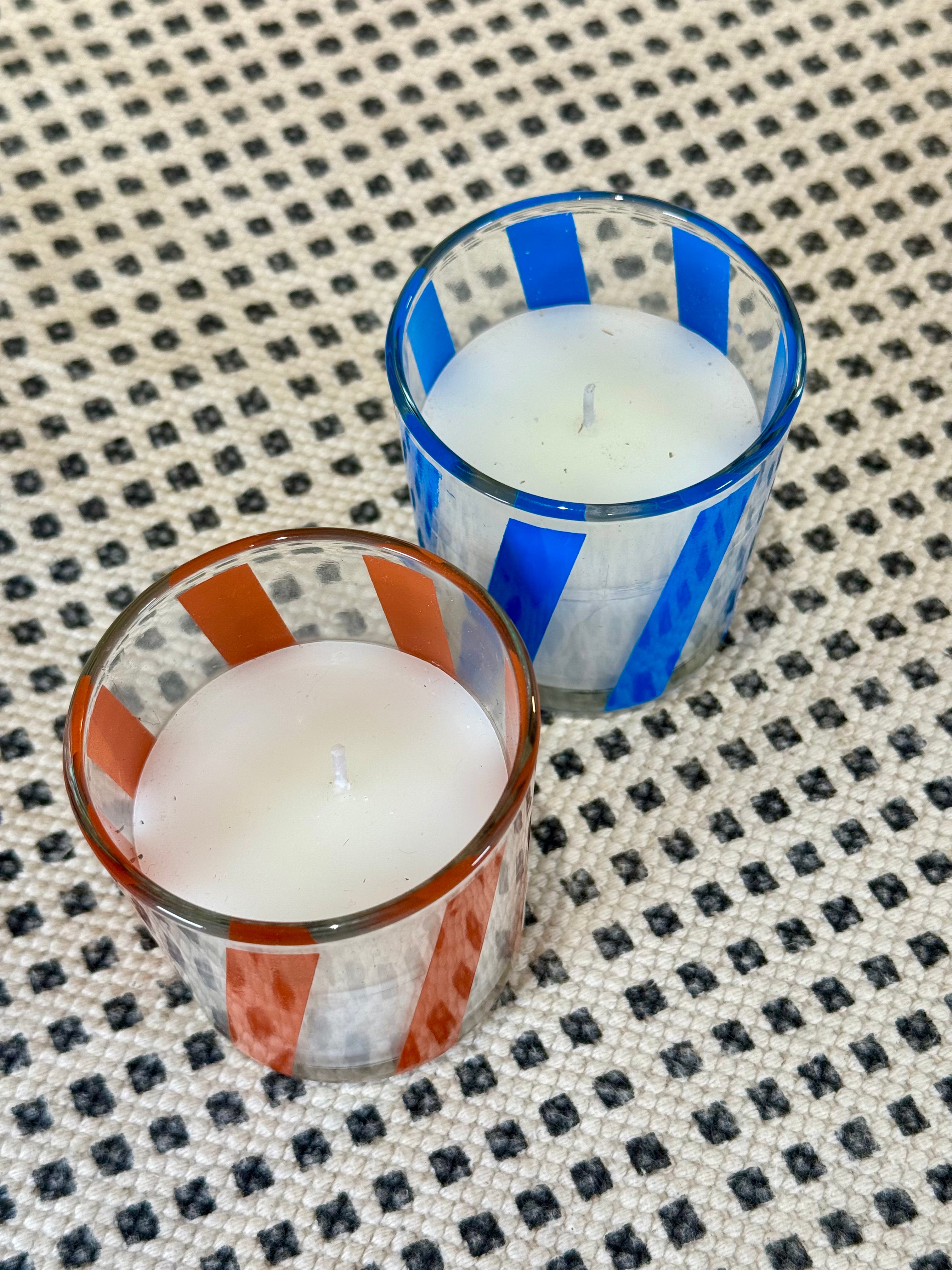 Velas en recipiente de vidrio